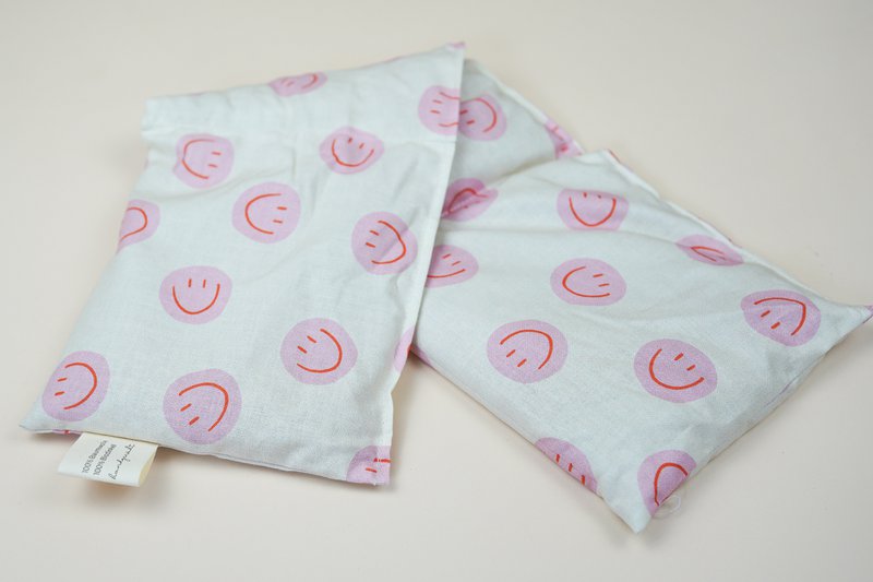 Katoenen warmtekussen gevuld met biologische spelt Smiley Pink