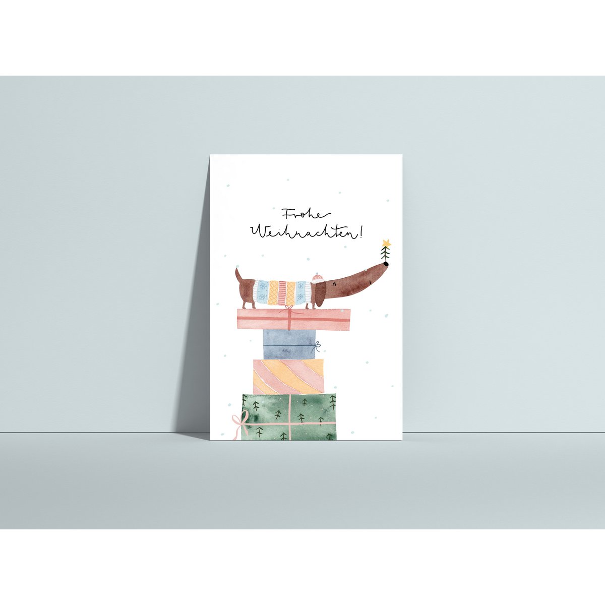 Christmas card Dachshund on gift, postcard