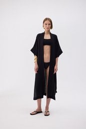 Black linen kimono with 32% linen and 68% cotton, featuring a loose, flowing design and an open front.