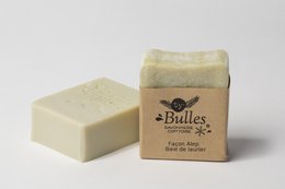 Organic soap bars in the Aleppo style, made with olive oil and laurel oil. Rectangular shape with a natural, earthy appearance.