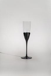  Set of 6 black champagne glasses with a tall, slender shape.
