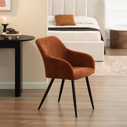 Upholstered dining chairs with a linen fabric in sand or terracotta color, featuring a curved backrest and black metal legs for a modern, minimalist design.