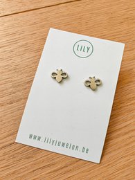  Silver-toned stud earrings featuring a delicate flower design.