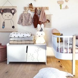 A white and cocoa-colored nightstand with a modern, minimalist design. Features a clean, rectangular shape and a combination of white and natural wood tones.