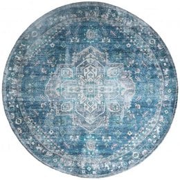 Round petrol blue area rug with intricate floral and geometric patterns.