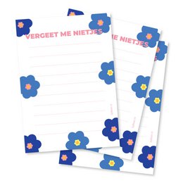 A6 sized notepad with a floral design featuring forget-me-not flowers in shades of blue and yellow. The notepad has a simple, minimalist style that would be suitable for everyday use or as a gift.