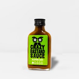 Crazy Bastard Hot Sauce jalapeño date, glass bottle black cap, green yellow label owl graphic design