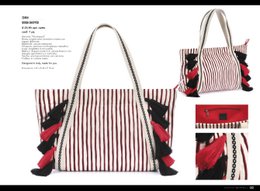 SHOPPER BAG WITH RED/BLACK STRIPES AND TASSELS