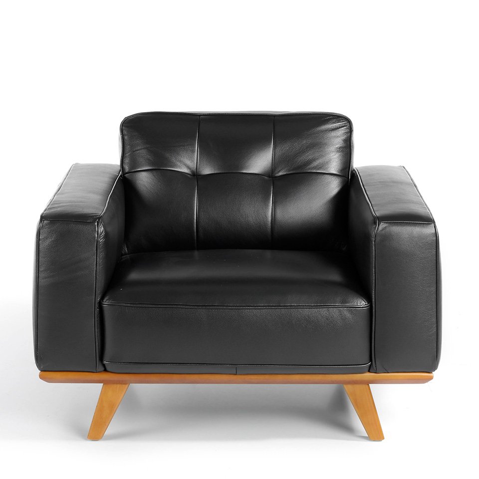 Armchair upholstered in leather and Walnut wood legs