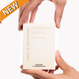 Strength and Growth scalp care product with a minimalist, clean design featuring a white box with black text and a simple logo. The product appears to be a hair or skincare item focused on nourishing and strengthening the scalp.
