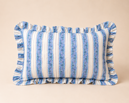  Rectangular blue and white striped cushion with tasseled edges.