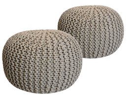 Two round, knitted pouf ottomans in beige and gray colors. The poufs have a coarse, textured appearance and are made of sustainable materials.