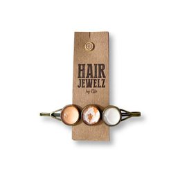 Taupe-colored hair clips with a wooden design and a button closure. The clips feature a simple, minimalist style that would complement a variety of hairstyles.