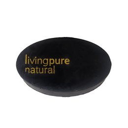Black oval-shaped bar soap with "livingpure natural" text in gold. Soap is suitable for facial cleansing.