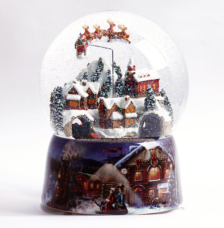 Kæmpe musikalsk sneglob "The Christmas Village" med et lille tog, julemandens slæde trukket af hans rensdyr og blandingen