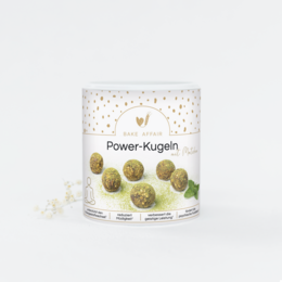 Green matcha-flavored power balls in a clear container with a white label.