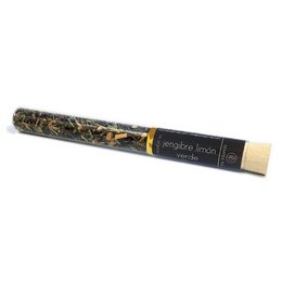 Loose green tea with ginger and lemon in a glass tube. The tea is organic and has a natural, earthy aroma.
