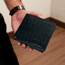 Luxury green napa leather wallet with slim croc-pattern design, coin pocket, and card slots.