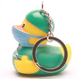  A colorful, rubber duck-shaped bath toy with a green and yellow body, and a blue face mask. This playful and whimsical item is designed for children's bath time fun.