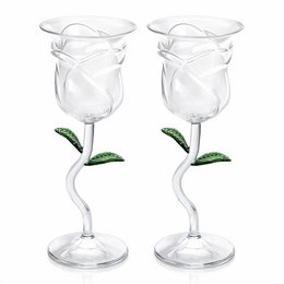 Clear glass wine glasses with rose flower stem design, elegant curved shape, decorative green leaves detail