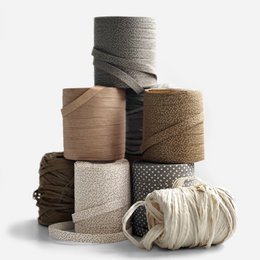  Compostable decorative ribbon made of ECO raffia, available in various colors and styles (twisted or flat), in widths of 10mm and lengths of 50m or 100m.