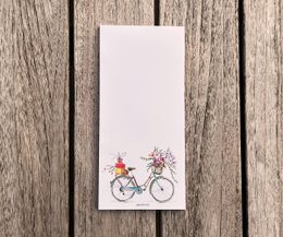 Writing block | Beautiful bike with flowers DIN format (long) 99 x 210 mm | Blank white