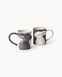  Set of 2 ceramic mugs with 3D rabbit design in gray and white colors. Unique shaped handles. Suitable for hot and cold beverages. Capacity: 380 ml.