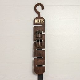 Wooden belt organizer with multiple hooks for storing and organizing belts. Available in natural, brown, rustic white, and black finishes. Ideal for closet storage and a thoughtful Father's Day gift.
