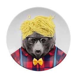 A round plate with a bear wearing glasses, a bowtie, and a plaid shirt, with a pile of yellow noodles on its head.