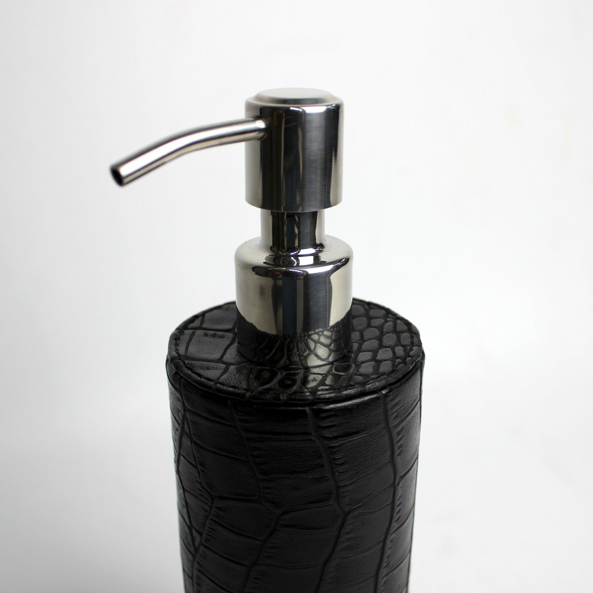 Round soap dispenser in crocodile look-black and stainless steel