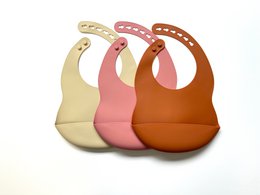 Soft, silicone bibs in navy blue, light blue, old pink, ocher, khaki, and beige colors. Durable, waterproof, and easy to clean. Suitable for babies and toddlers.
