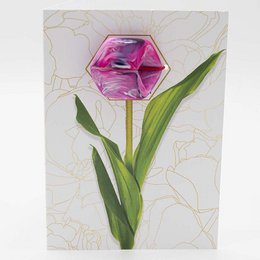 A pink, hexagonal greeting card with a spring flower design.