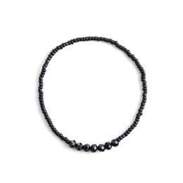 Black beaded bracelet with round beads.