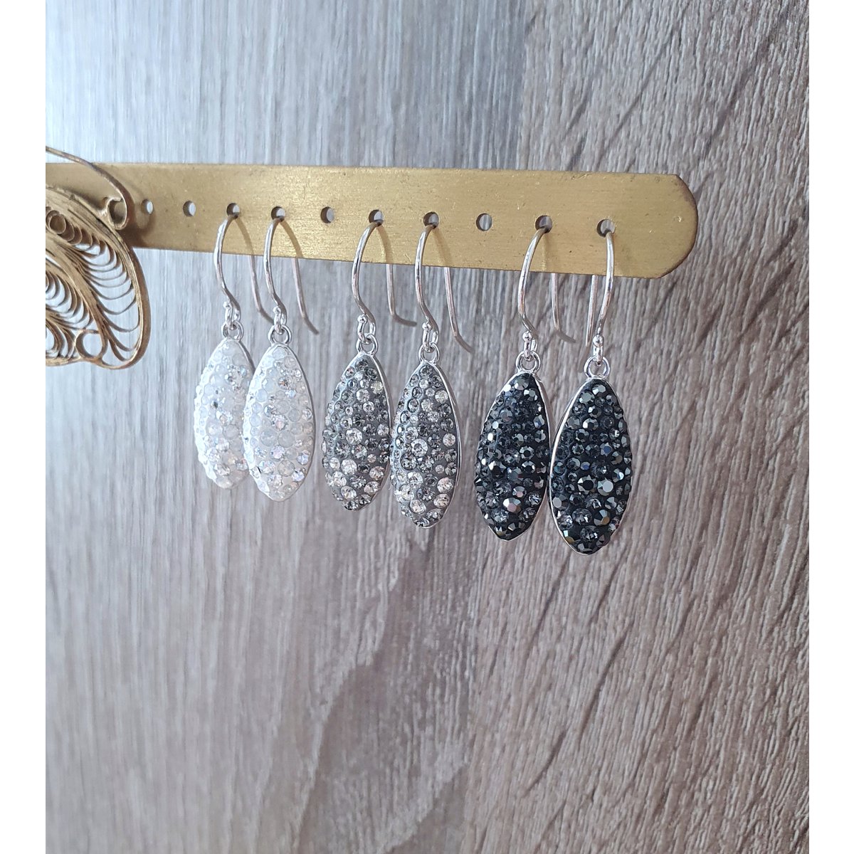 Petite rhodium plated earrings with grey pavé drops