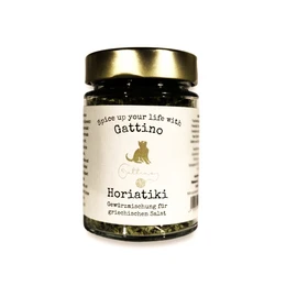 Harissa spice mixture, a blend of chili peppers, garlic, cumin, and other spices, with a vibrant orange-red color and a complex, aromatic flavor profile.