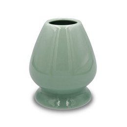 Light green ceramic matcha whisk holder with a simple, minimalist design. Suitable for storing and displaying a traditional Japanese matcha whisk.