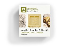 White clay and shea butter soap bar with botanical imprint.