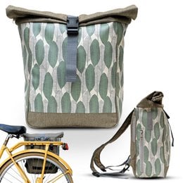 A green and white patterned backpack/bike bag with a roll-top closure and adjustable straps.