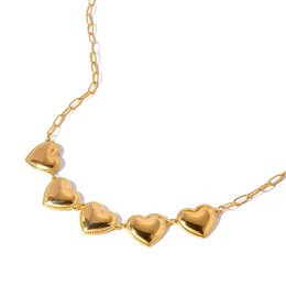 Gold-toned heart-shaped charm necklace with a delicate chain.