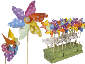 Multicoloured windmilll with white dots on wooden,