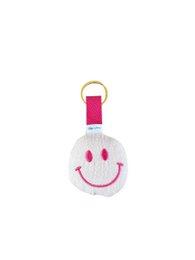 White smiley face keychain with pink accents, smiling expression, soft fabric material, round shape.