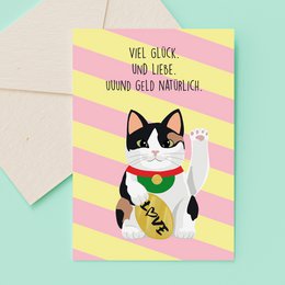  Greeting card with a celebratory cat wearing a party hat and holding a bottle of champagne. The card has the text "Cheers" printed on it.