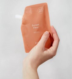 Hand sanitizer refill pouches in various scents including Sunset Fleur, Citrus Noon, Dew of Dawn, Morning Glory, and Wood Night.