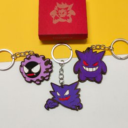Wooden Arbok Pokémon keychain, custom geek anime gift, nerd video game fan. Purple snake-like Pokémon character with red eyes and fangs.