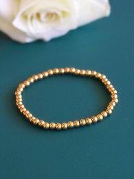 Aquilea – Armbandstapel aus Goldperlen