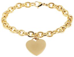 Pulsera "Keynie" de acero inoxidable con colgante de corazón, 22 cm, color dorado