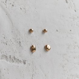 Bronze stud earrings with a minimalist, modern design.