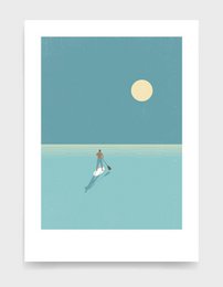 Paddleboarder o zachodzie słońca