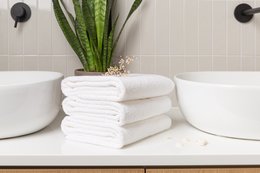 White terry cloth bath towels, soft and absorbent, perfect for drying off after a relaxing bath or shower.