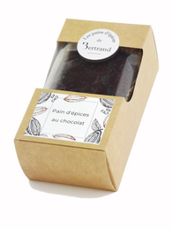 Chocolate gingerbread cookie in a rectangular box. The cookie is dark brown in color with a light-colored label on top.
